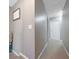 Upstairs hallway leading to bedrooms and bathrooms, featuring neutral paint colors at 5099 Leeshire Trce, Tucker, GA 30084