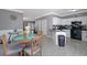 Open concept kitchen featuring an adjacent dining area and modern appliances at 5099 Leeshire Trce, Tucker, GA 30084
