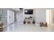 Open living room with tile floors, staircase, and decorative vases on a side table at 5099 Leeshire Trce, Tucker, GA 30084