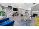 Bright living room with a staircase, stylish decor, and an open concept design at 5099 Leeshire Trce, Tucker, GA 30084