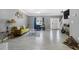 Large living room with tile floors, stylish furniture, and ample natural light at 5099 Leeshire Trce, Tucker, GA 30084