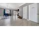 Open living space with tile floors, blue curtains, and views towards the entry at 5099 Leeshire Trce, Tucker, GA 30084