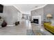 Expansive living room features tiled floors, a fireplace, and an open layout at 5099 Leeshire Trce, Tucker, GA 30084