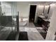 Modern bathroom featuring a freestanding tub, glass shower, and stylish vanity with marble floors at 1208 Lauren Nw Ct, Acworth, GA 30101