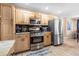 Traditional kitchen featuring stainless steel appliances, wood cabinets, and recessed lighting at 1208 Lauren Nw Ct, Acworth, GA 30101