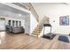 Bright living area with beautiful staircase, wood floors, and seamless transition to living room at 1208 Lauren Nw Ct, Acworth, GA 30101