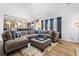 Cozy living room with a large sectional sofa, perfect for relaxing and entertaining at 1208 Lauren Nw Ct, Acworth, GA 30101