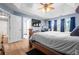 Spacious main bedroom with a king-size bed, large windows, and a ceiling fan at 1208 Lauren Nw Ct, Acworth, GA 30101