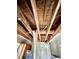 Kitchen with wooden cabinets, double sink, and view of the exposed ceiling at 1386 Bluefield Sw Dr, Atlanta, GA 30310