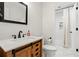 Bathroom features a dark wood cabinet, white counter and a walk-in shower at 1428 Downs Sw Dr, Atlanta, GA 30311