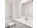 Bathroom with vanity, shower over tub and toilet at 1838 Lacebark Elm Way, Lawrenceville, GA 30045