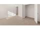 Bedroom showcasing neutral carpet and an open closet, creating a move-in ready space at 1838 Lacebark Elm Way, Lawrenceville, GA 30045