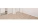 Large primary bedroom with neutral carpet and large doorway and doors at 1838 Lacebark Elm Way, Lawrenceville, GA 30045