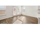 Dining area with sliding glass doors leading to outdoor patio and windows for natural light at 1838 Lacebark Elm Way, Lawrenceville, GA 30045