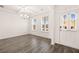 Bright dining room featuring hardwood floors, crown molding, and ample natural light at 1838 Lacebark Elm Way, Lawrenceville, GA 30045