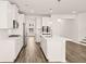 Modern kitchen featuring stainless steel appliances, a center island, and an open layout at 1838 Lacebark Elm Way, Lawrenceville, GA 30045