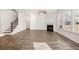 Open floor plan with fireplace and staircase leading to the second floor at 1838 Lacebark Elm Way, Lawrenceville, GA 30045