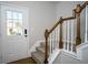 Entryway featuring a staircase with carpeted steps and wood railings at 2715 Maple Park Pl # 30, Cumming, GA 30041