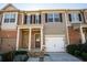Charming townhome featuring stone accents, attached garages, and well-maintained landscaping at 2715 Maple Park Pl # 30, Cumming, GA 30041