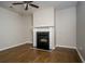 Cozy living room with hardwood floors and fireplace at 2715 Maple Park Pl # 30, Cumming, GA 30041