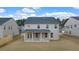 Large backyard with a covered patio and plenty of green space for outdoor activities at 1828 Lacebark Elm Way, Lawrenceville, GA 30045