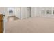 Carpeted room features natural light from two windows and two closets at 1828 Lacebark Elm Way, Lawrenceville, GA 30045