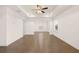 Large Primary bedroom features hardwood floors, tray ceiling, ceiling fan, and plenty of natural light at 1828 Lacebark Elm Way, Lawrenceville, GA 30045