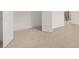 Neutral-colored carpeted bedroom featuring two open doors at 1828 Lacebark Elm Way, Lawrenceville, GA 30045