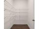 Spacious walk-in closet with wire shelving providing ample storage for clothing and accessories at 1828 Lacebark Elm Way, Lawrenceville, GA 30045