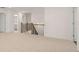 Hallway with carpet, a wooden banister, and an open doorway at 1828 Lacebark Elm Way, Lawrenceville, GA 30045