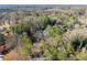 Aerial view of a wooded lot with houses nestled among mature trees at 2790 Collier Nw Dr, Atlanta, GA 30318