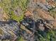 Aerial view shows roof of house surrounded by trees, neighboring houses, and a street at 2790 Collier Nw Dr, Atlanta, GA 30318