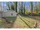 Lush backyard featuring a well-maintained lawn, offering privacy and ample space for recreation at 2790 Collier Nw Dr, Atlanta, GA 30318