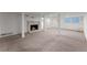 Finished basement featuring carpeted floor, brick fireplace and white columns at 2790 Collier Nw Dr, Atlanta, GA 30318