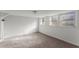 Finished basement featuring neutral carpet, white walls, and three frosted windows at 2790 Collier Nw Dr, Atlanta, GA 30318