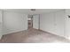 Finished basement with neutral carpet, white walls, and a view to a brick fireplace at 2790 Collier Nw Dr, Atlanta, GA 30318