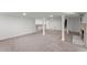 Finished basement featuring carpeted floor, brick fireplace and white columns at 2790 Collier Nw Dr, Atlanta, GA 30318