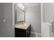 Bathroom showcasing a sleek vanity, framed mirror, with a walk-in shower at 2790 Collier Nw Dr, Atlanta, GA 30318