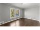 Bedroom with a large window and hardwood floors at 2790 Collier Nw Dr, Atlanta, GA 30318