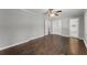 Bright bedroom features hardwood floors, ceiling fan and ensuite bathroom with tiled walk-in shower at 2790 Collier Nw Dr, Atlanta, GA 30318