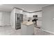 Bright kitchen featuring white cabinets, stainless steel appliances, and an island with a granite countertop at 2790 Collier Nw Dr, Atlanta, GA 30318