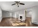 Spacious living room with hardwood floors, fireplace, ceiling fan and ample natural light at 2790 Collier Nw Dr, Atlanta, GA 30318