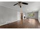 Bright and airy living room featuring hardwood floors, a fireplace, and neutral-colored walls at 2790 Collier Nw Dr, Atlanta, GA 30318