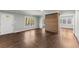 Open-concept living room with hardwood floors, large windows, wood feature and lots of natural light at 2790 Collier Nw Dr, Atlanta, GA 30318