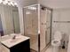 Bathroom showcasing a glass-enclosed shower, sleek vanity, and modern fixtures for convenience at 3015 Camden Way, Alpharetta, GA 30005