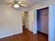 Bedroom showcasing a ceiling fan, a storage closet, and a connecting closet at 3015 Camden Way, Alpharetta, GA 30005