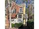 Charming townhome with a brick facade, inviting entryway, and well-maintained landscaping at 3015 Camden Way, Alpharetta, GA 30005