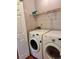 Bright laundry room with side-by-side washer and dryer at 3015 Camden Way, Alpharetta, GA 30005