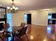 Open concept living room and dining area with hardwood floors and a view of the kitchen at 3015 Camden Way, Alpharetta, GA 30005