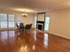 Spacious living room with a fireplace, a large mirror, and gleaming hardwood floors at 3015 Camden Way, Alpharetta, GA 30005